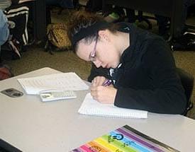 Girl writing in notebook